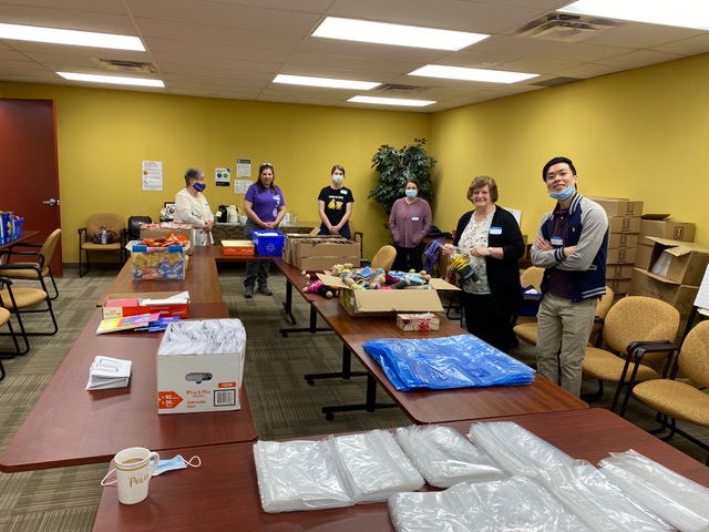 Volunteers helping put together care packages