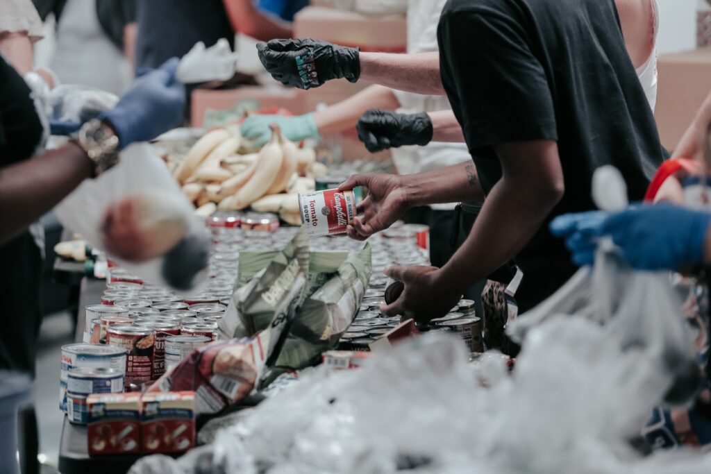 Volunteers at a food bank distributing non-perishable items